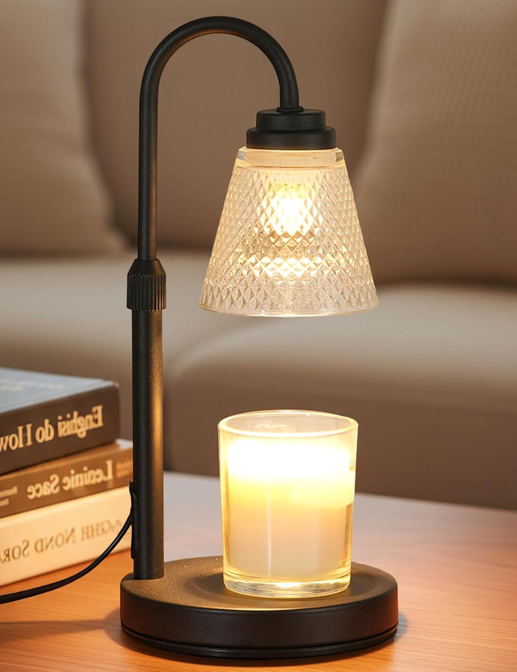 Black candle warmer lamp with glass shade over a jar candle